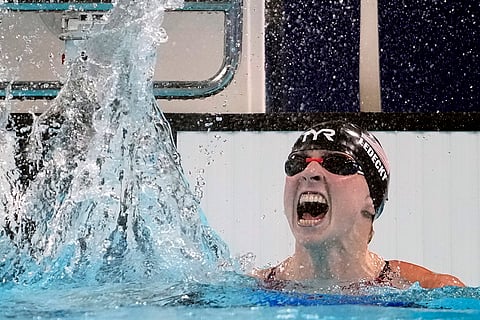 Katie Ledecky celebrates after winning the women's 1500-meter freestyle final